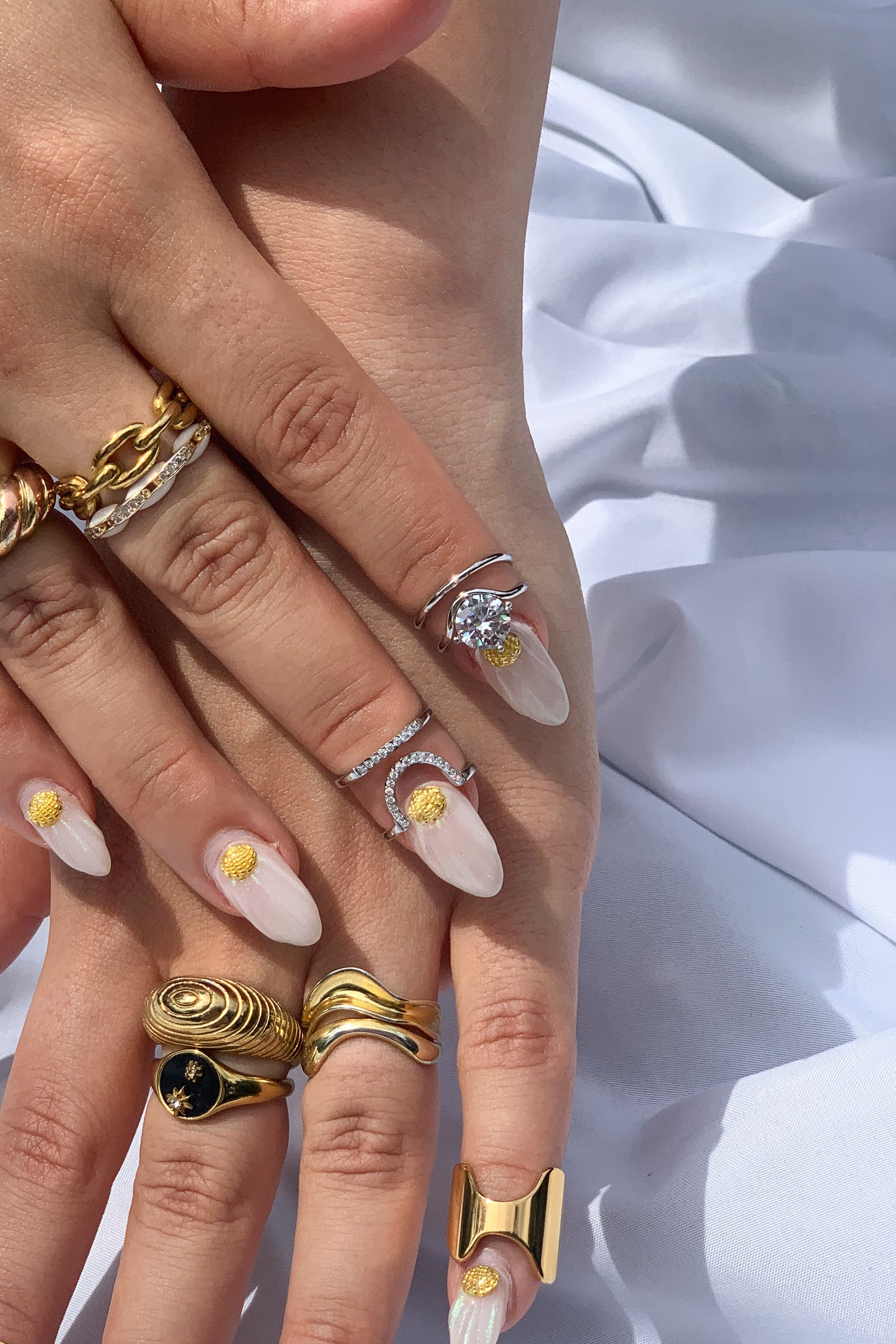 White nails with deals rings